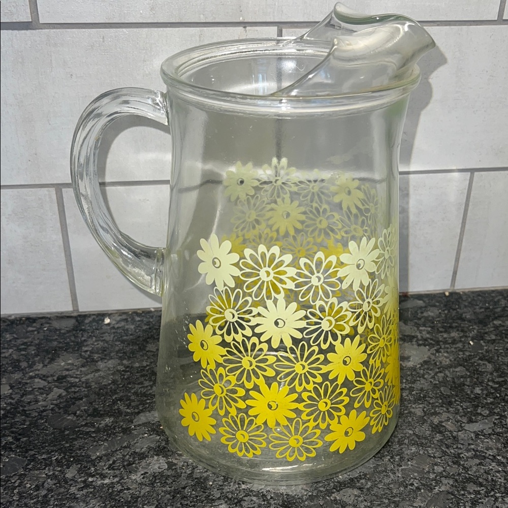 Vintage Glass Pitcher with Yellow Daisy Design. Nice heavy weight. 8.5” tall.